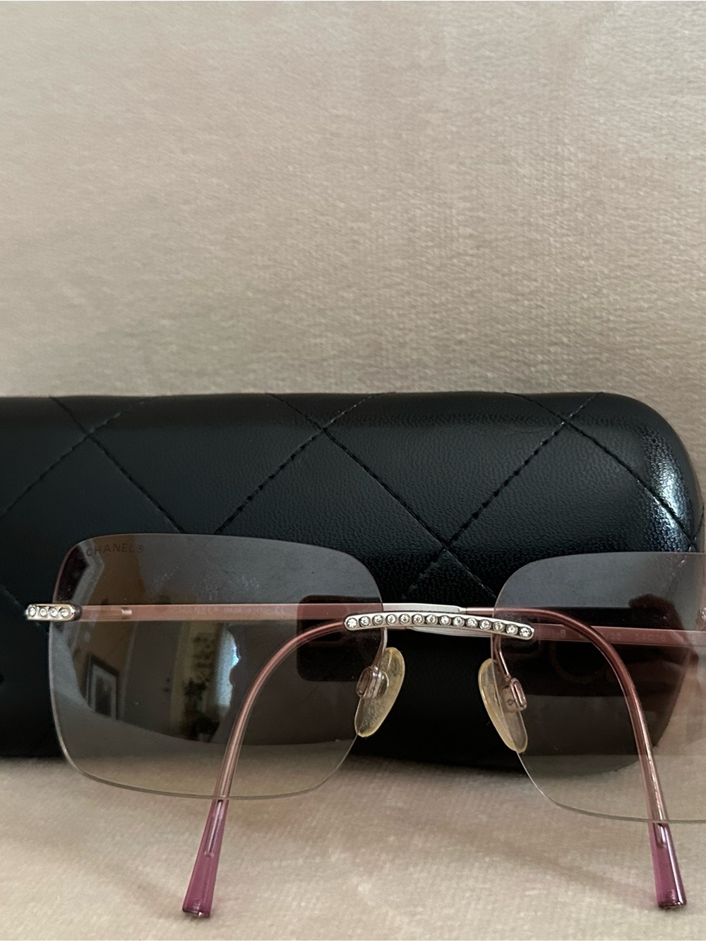 CHANEL Pink Rimless Sunglasses with Crystal Bridge